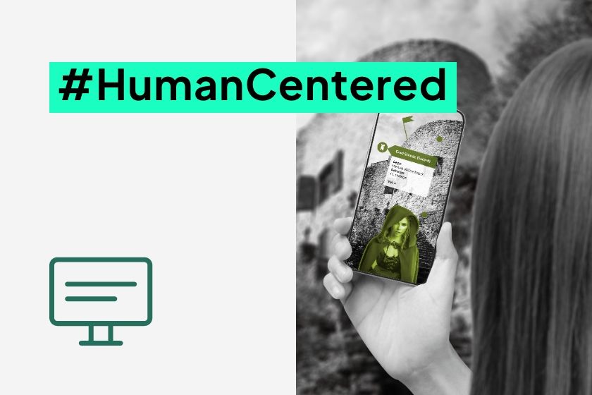 Smartphone usage with a graphic interface and the text #HumanCentered.