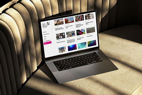 Laptop on a sofa showing the 3D4CH platform website with various articles and resources about 3D technologies for cultural heritage.